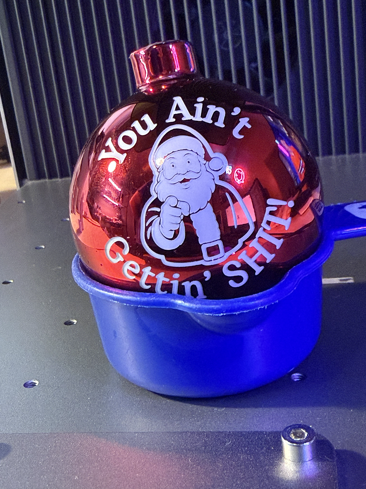 Laser engraved glass Christmas ornament with funny message